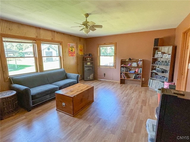 living room featuring ceiling fan and wood-type flooring