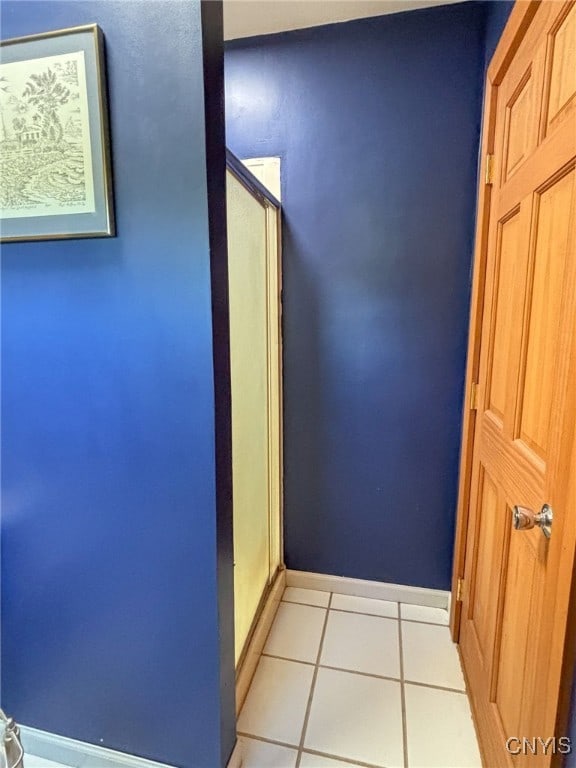 corridor with light tile patterned floors