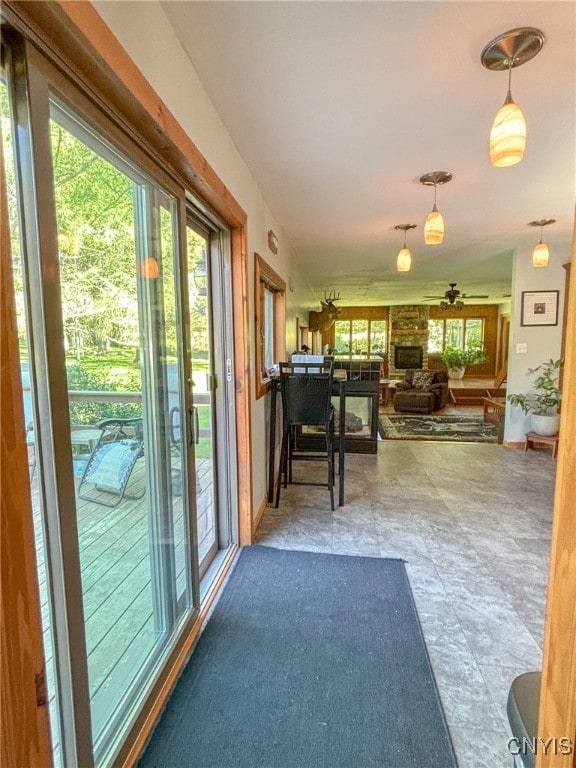 interior space with pendant lighting and ceiling fan