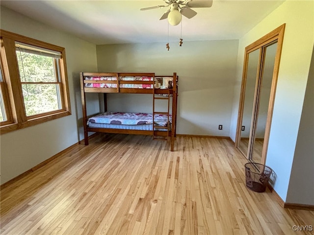 bedroom featuring ceiling fan and light hardwood / wood-style floors