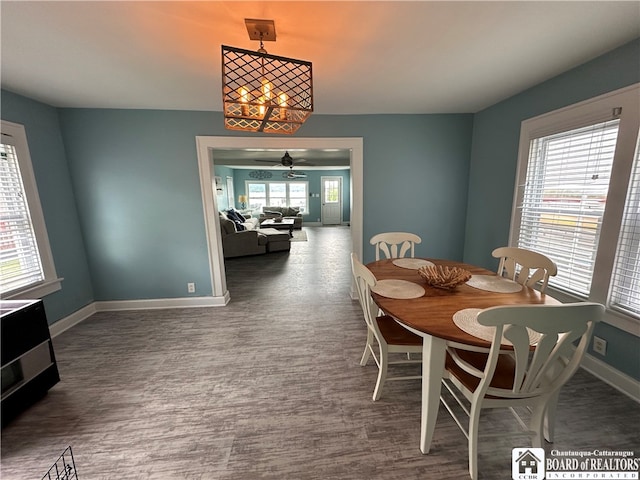 dining area featuring hardwood / wood-style flooring and ceiling fan