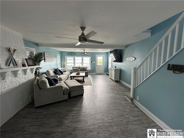 living room with a textured ceiling, ceiling fan, and hardwood / wood-style floors