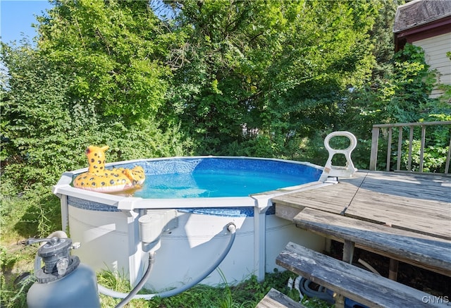 view of pool with a wooden deck