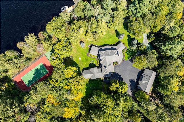 birds eye view of property with a water view