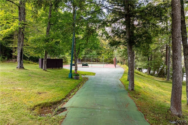 view of property's community featuring a yard