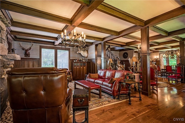 interior space featuring wood-type flooring, beam ceiling, and ornate columns