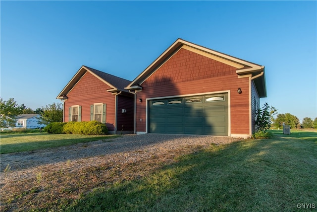 view of front of home featuring a garage and a front yard