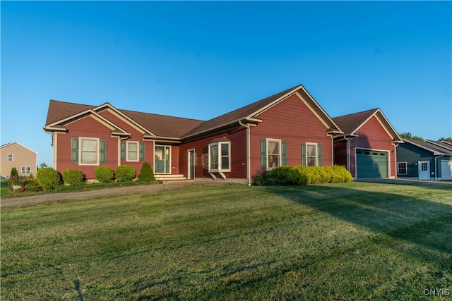 single story home featuring a garage and a front lawn