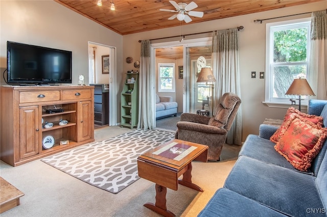 living room with lofted ceiling, ceiling fan, light colored carpet, and wooden ceiling