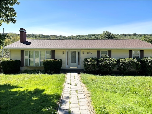 ranch-style house with a front yard