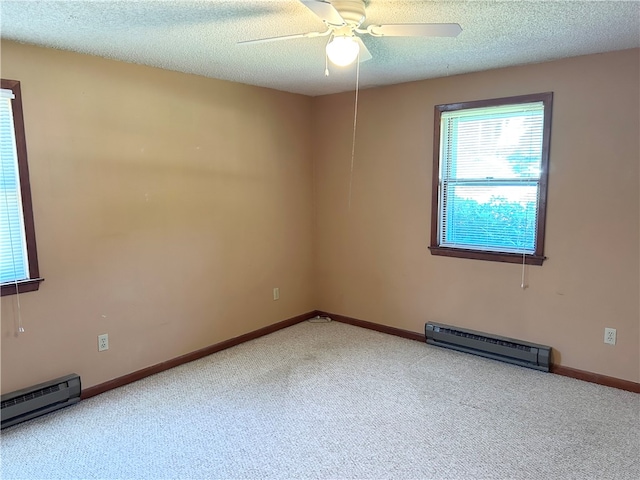 empty room featuring light colored carpet, a textured ceiling, a baseboard radiator, and ceiling fan