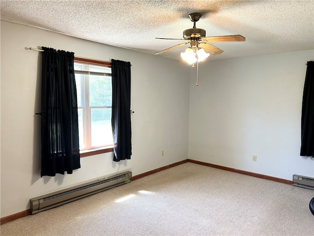 carpeted spare room featuring a textured ceiling, a baseboard radiator, and ceiling fan