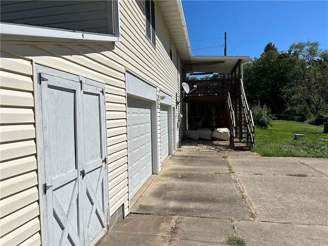 view of side of property featuring a garage