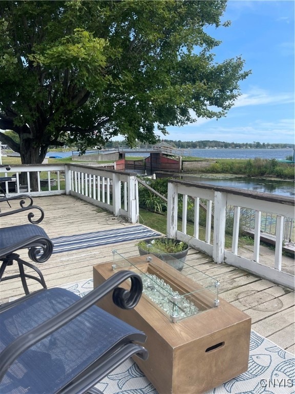 deck featuring a water view