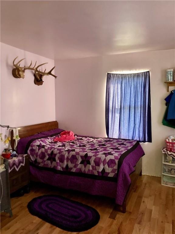 bedroom with light wood-type flooring