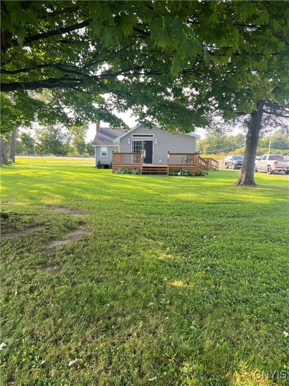 view of yard with a deck