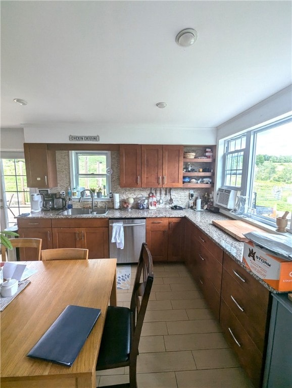 kitchen with cooling unit, dishwasher, backsplash, sink, and light stone counters