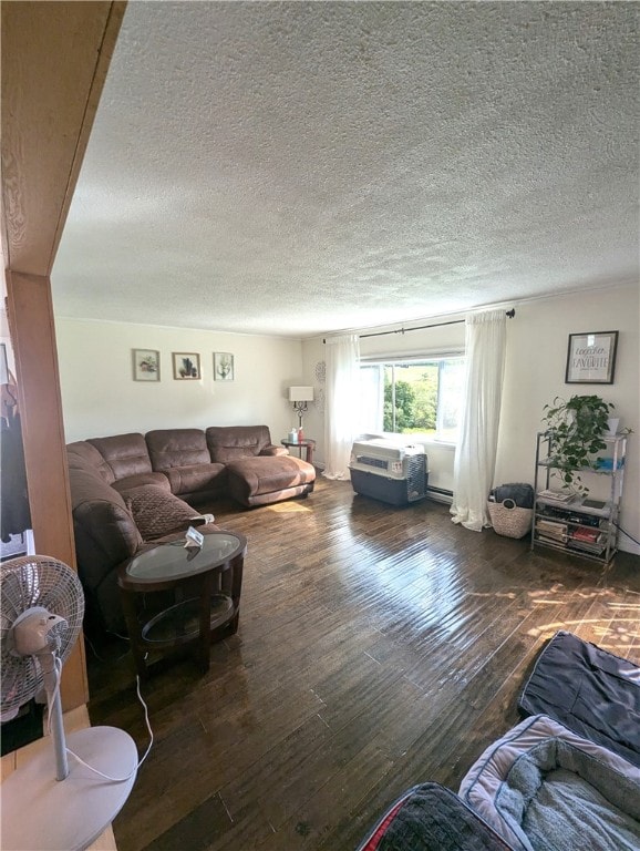 living room with dark hardwood / wood-style flooring and a textured ceiling