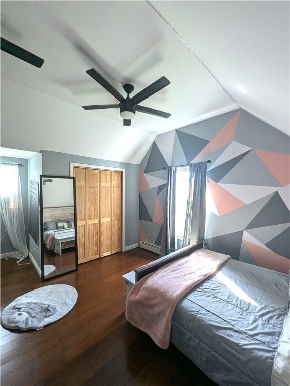 bedroom with lofted ceiling, ceiling fan, a baseboard heating unit, and dark hardwood / wood-style flooring