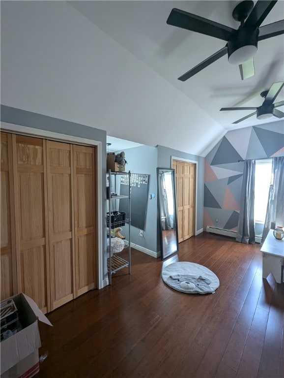 bonus room with dark hardwood / wood-style flooring, ceiling fan, a baseboard radiator, and vaulted ceiling