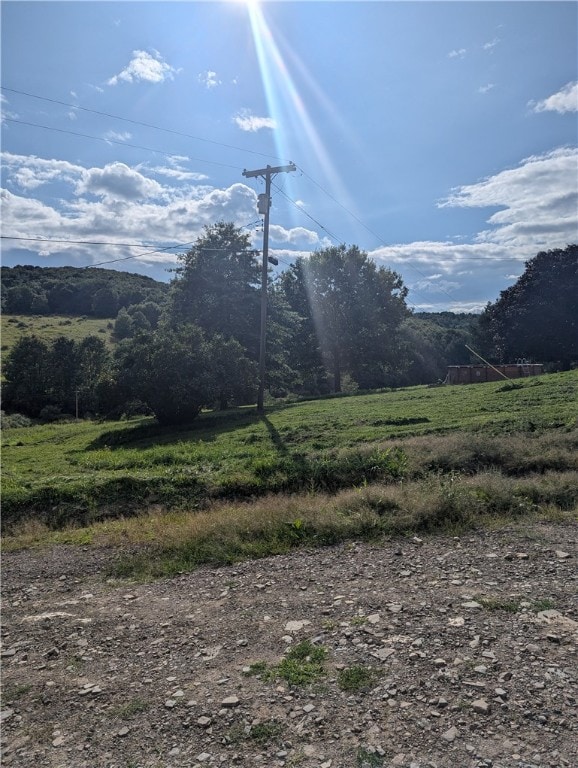 property view of mountains featuring a rural view