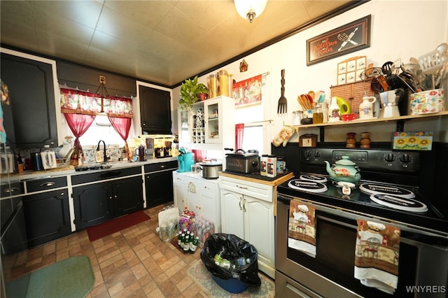 kitchen featuring sink and electric range