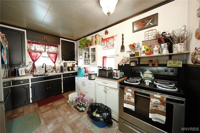 kitchen featuring sink and stainless steel range with electric cooktop