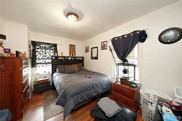 bedroom featuring dark hardwood / wood-style flooring