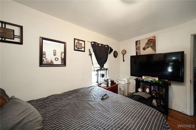 bedroom featuring dark wood-type flooring