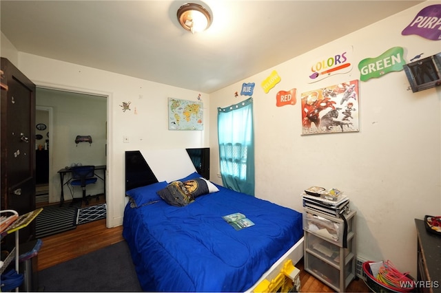 bedroom featuring dark hardwood / wood-style floors