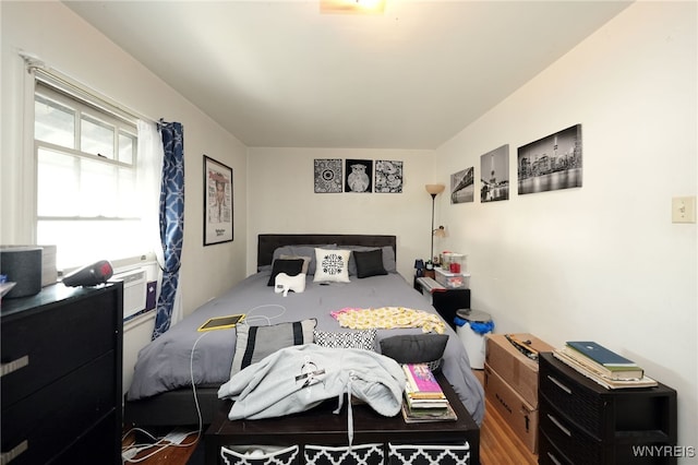 bedroom featuring cooling unit and wood-type flooring