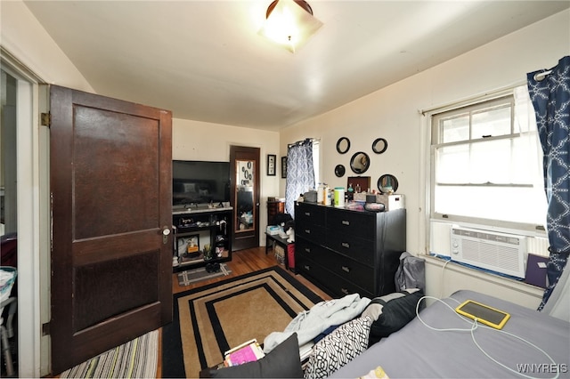 interior space featuring cooling unit and dark hardwood / wood-style floors