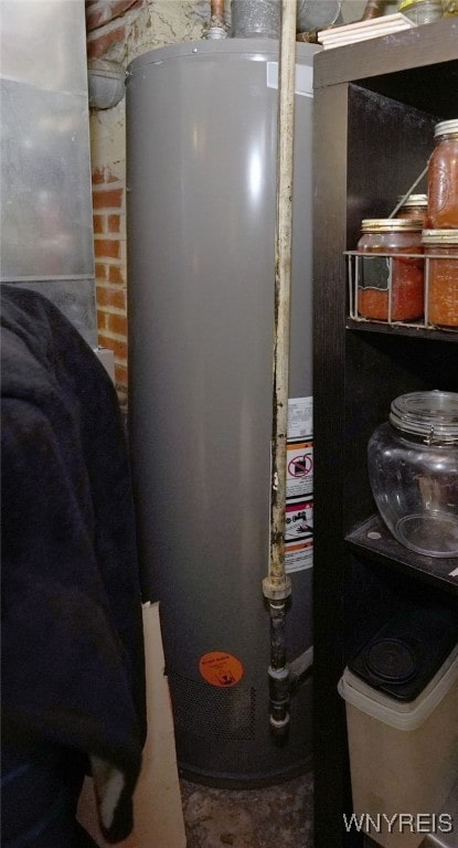 utility room featuring water heater