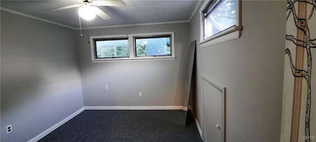 spare room with baseboards, ceiling fan, and ornamental molding