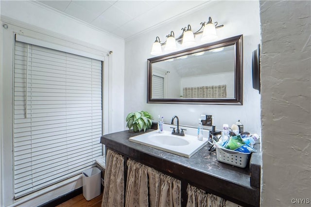 bathroom featuring vanity and ornamental molding