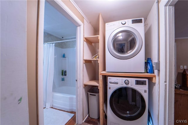 washroom with laundry area and stacked washer and dryer