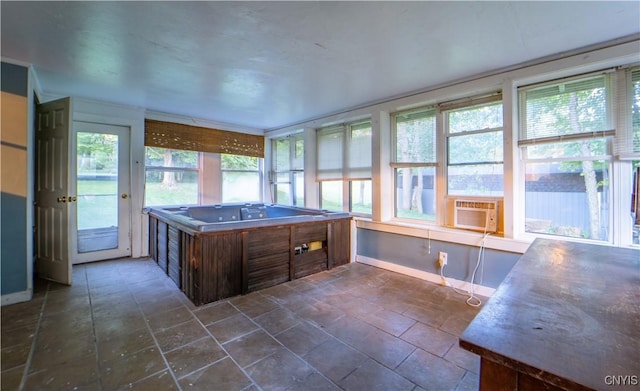 unfurnished sunroom featuring a wealth of natural light