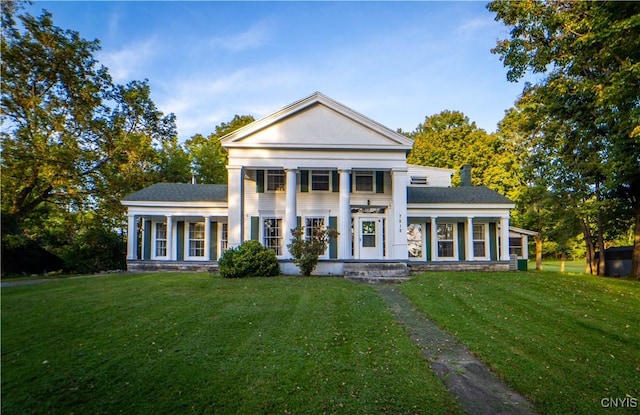 neoclassical / greek revival house with a front lawn
