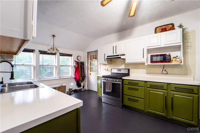 kitchen featuring stainless steel gas stove, under cabinet range hood, white cabinets, black microwave, and green cabinetry
