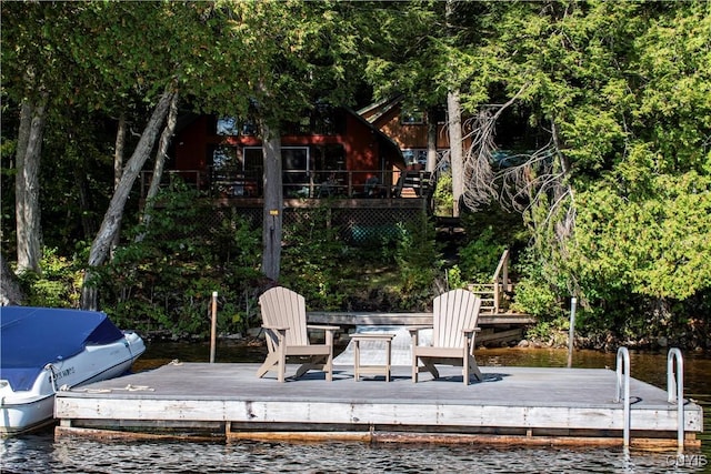 114 Big Moose Lk, Webb, NY 13331 - wooden terrace featuring a floating dock and a water view