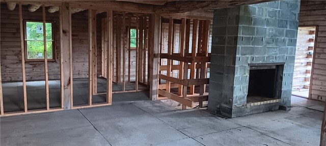 miscellaneous room with a stone fireplace