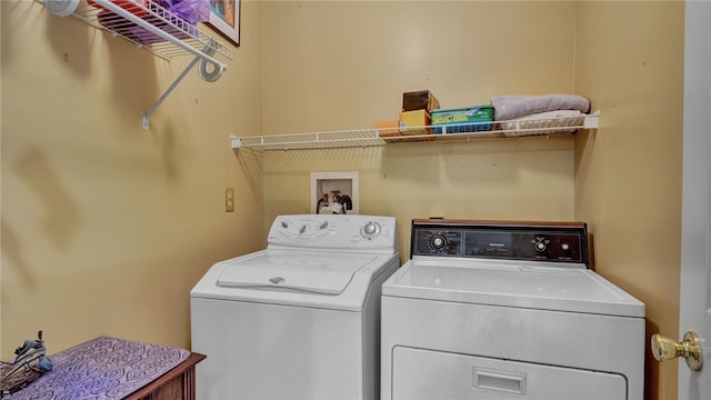 clothes washing area featuring washing machine and clothes dryer