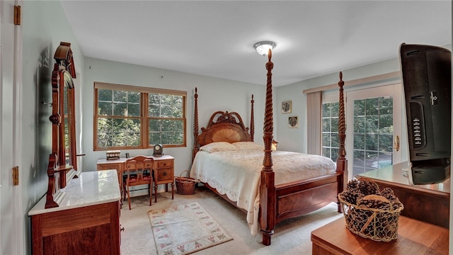 bedroom featuring light carpet