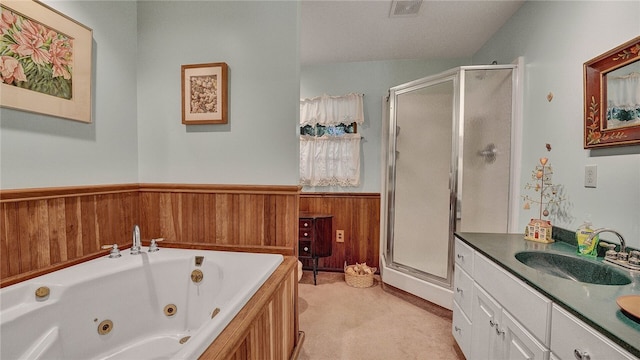 bathroom featuring wooden walls, shower with separate bathtub, and vanity