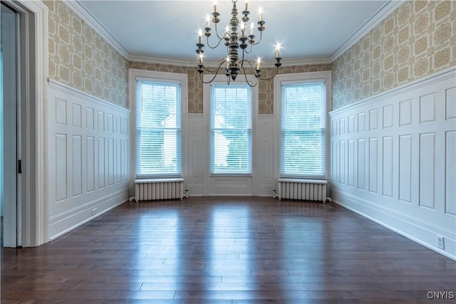 unfurnished dining area with crown molding, wallpapered walls, and radiator heating unit