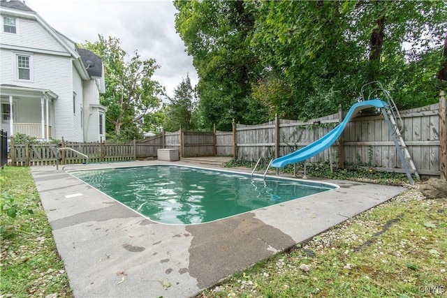 view of swimming pool featuring a fenced backyard, a fenced in pool, and a water slide