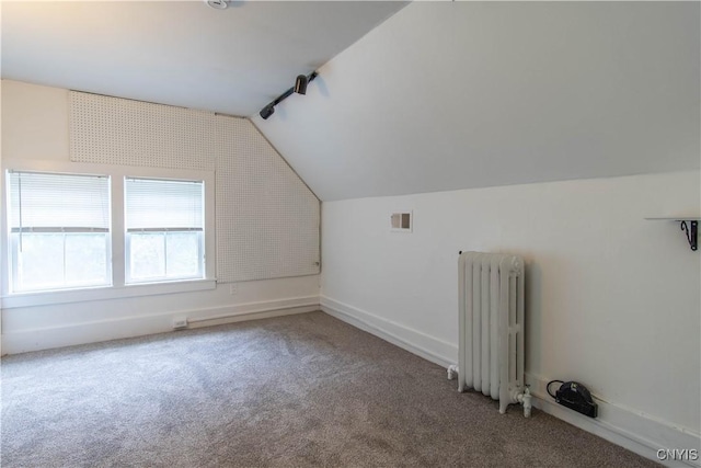 bonus room with visible vents, radiator, baseboards, carpet, and lofted ceiling