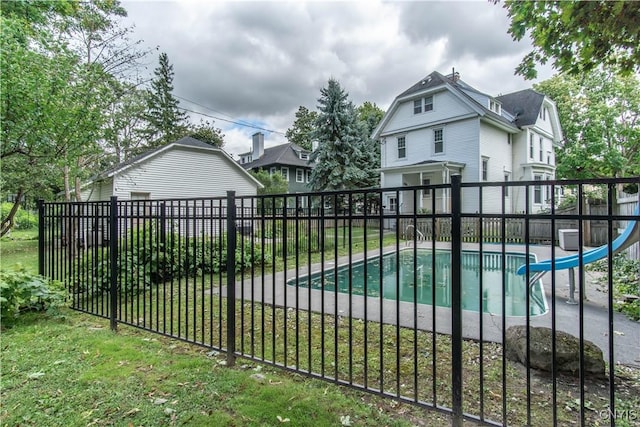 exterior space featuring fence and a fenced in pool