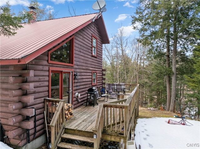 snow covered deck with area for grilling