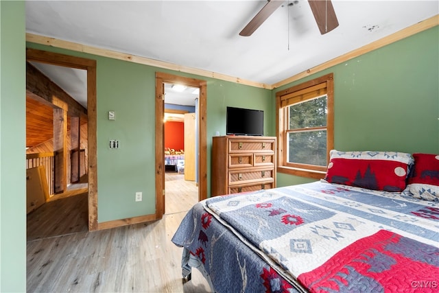 bedroom with hardwood / wood-style flooring and ceiling fan